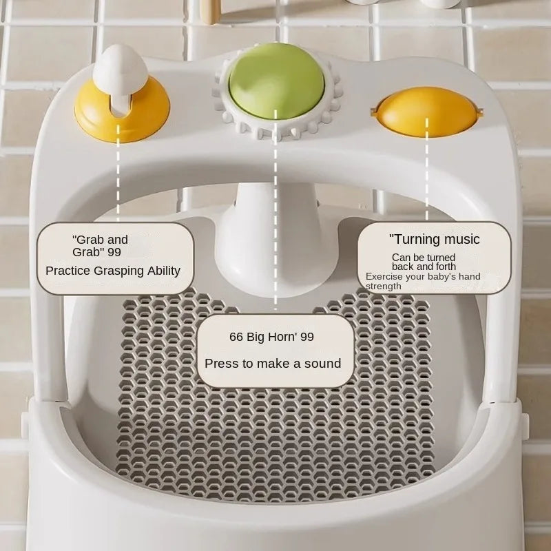 Baby toy with buttons and text labels on a tiled wall background