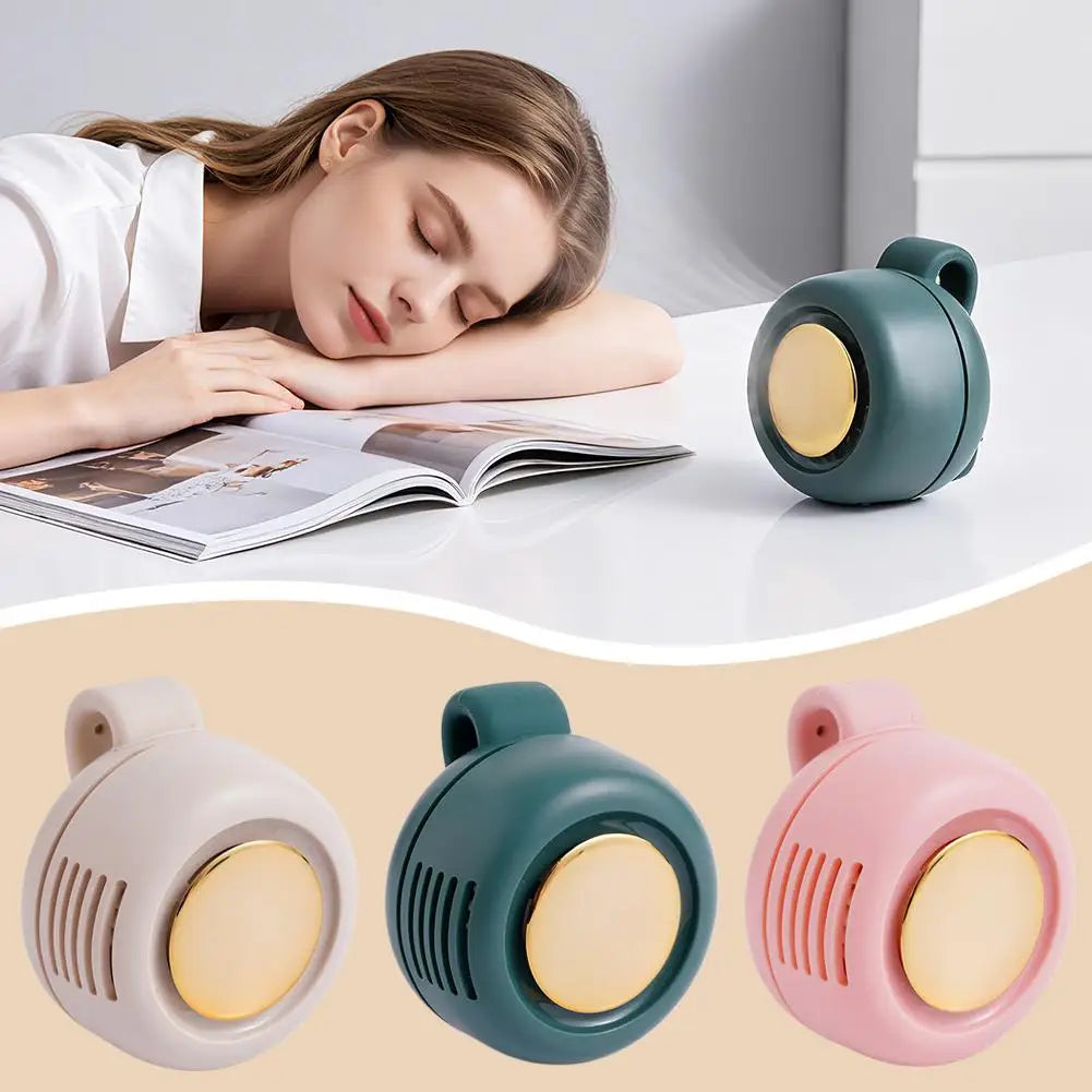 Woman reading a book with a white noise machine next to her, showing three different colored machines.