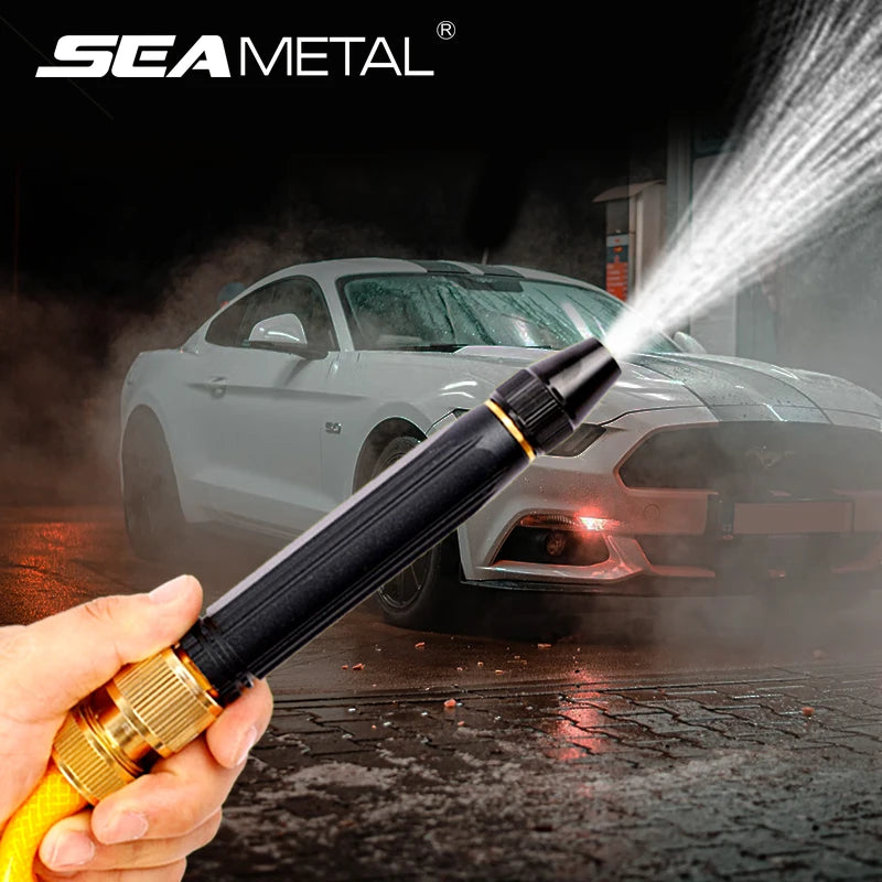 Person using a high-pressure washer to clean a car with 'Sea Metal' branding.