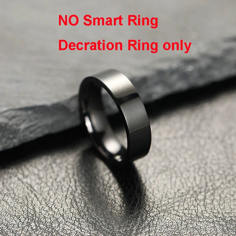 Black ring on a textured gray surface with text indicating it is a decoration ring only.