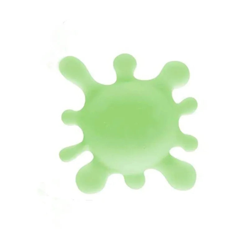 Green splatter pattern on a white background
