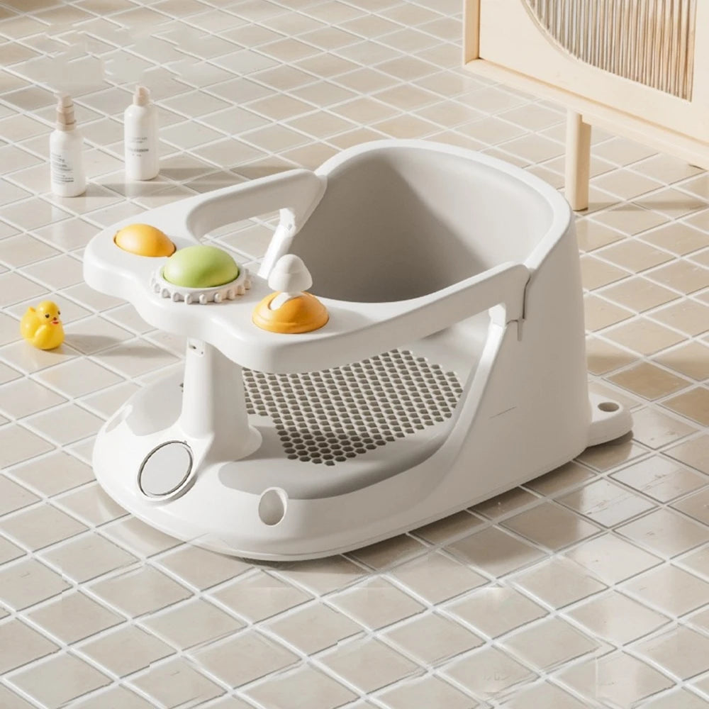 White bath seat with toys on a tiled bathroom floor