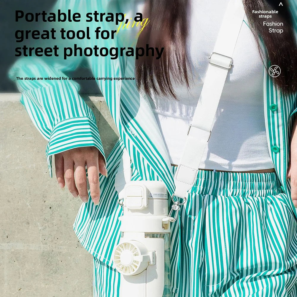 Person wearing a green and white striped outfit with a white strap over shoulder, text about portable strap for street photography.