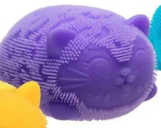 Purple and blue cat-shaped bath toy with a yellow ball on a white background